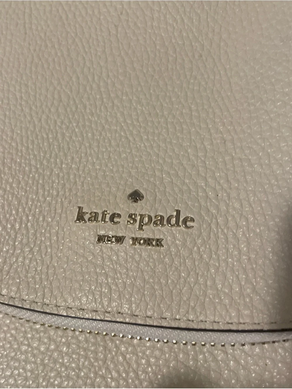 kate spade cream pebbled leather crossbody with gold logo